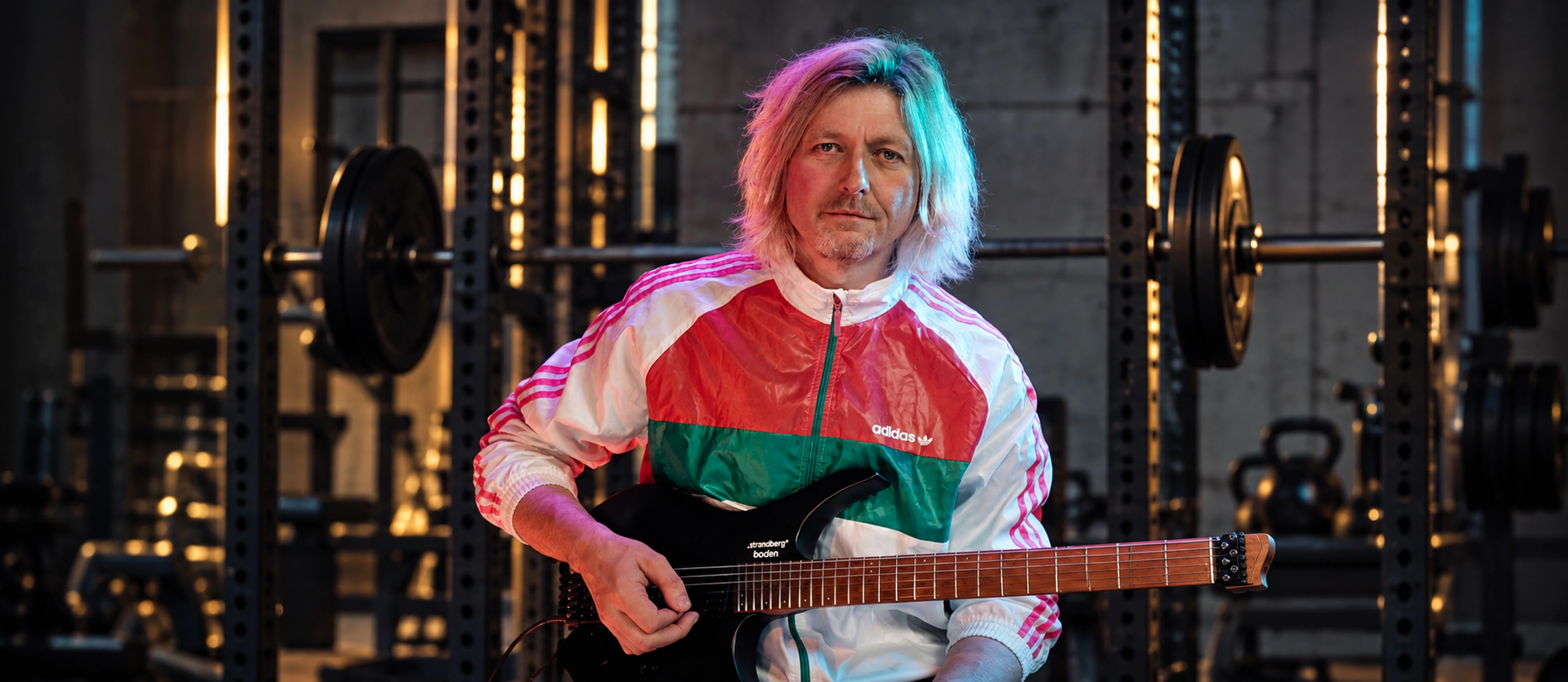 Tim Hutch with his guitar in Hutch’s Guitar Gym
