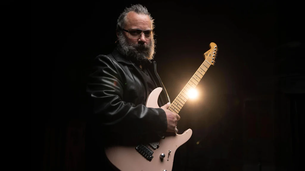 Rick Graham holding an electric guitar