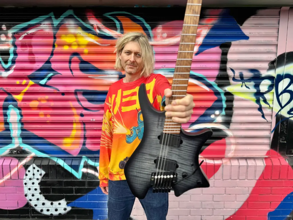 Tim Hutch playing his Strandberg guitar